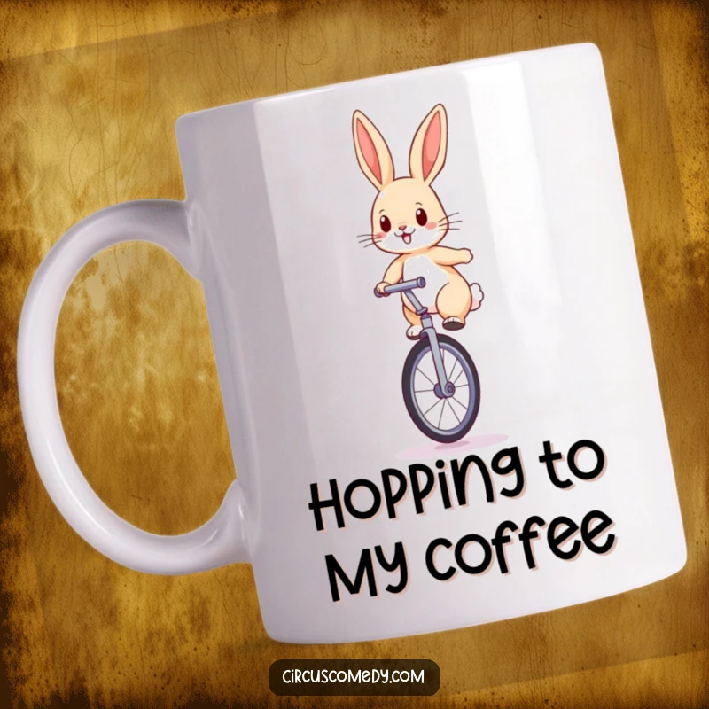 Funny rabbit mug featuring a determined rabbit balancing on a large unicycle with perked ears, ready to ride.