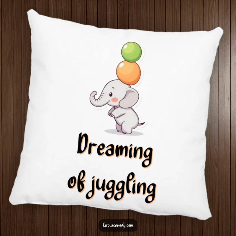 Funny Focused Elephant Pillow: A small elephant balances colorful balls on its trunk with intense focus, a soft and funny pillow.