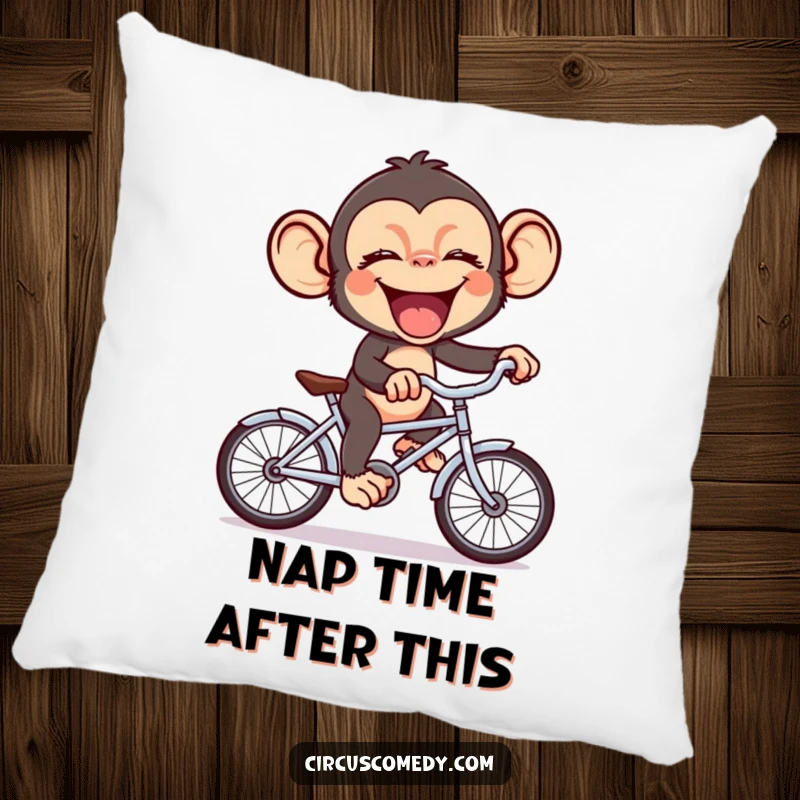 Funny chimp giggling heartily while balancing on a miniature bicycle, providing comfort and humor as a soft pillow.
