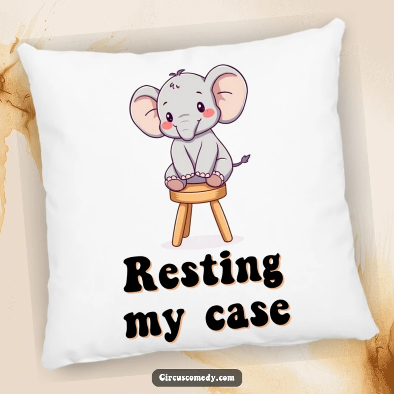 Funny pillow with a cute elephant balancing perfectly on a tiny stool, adding a touch of playful humor to any couch.