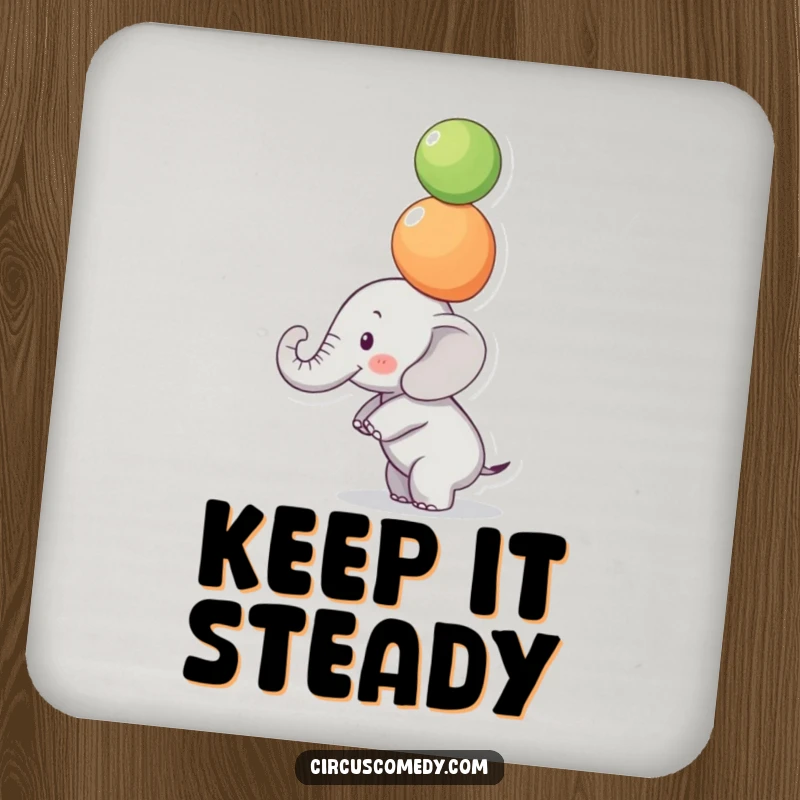 Funny Focused Elephant Drink Coaster: A small elephant balances colorful balls on its trunk with intense focus, a funny and protective coaster.