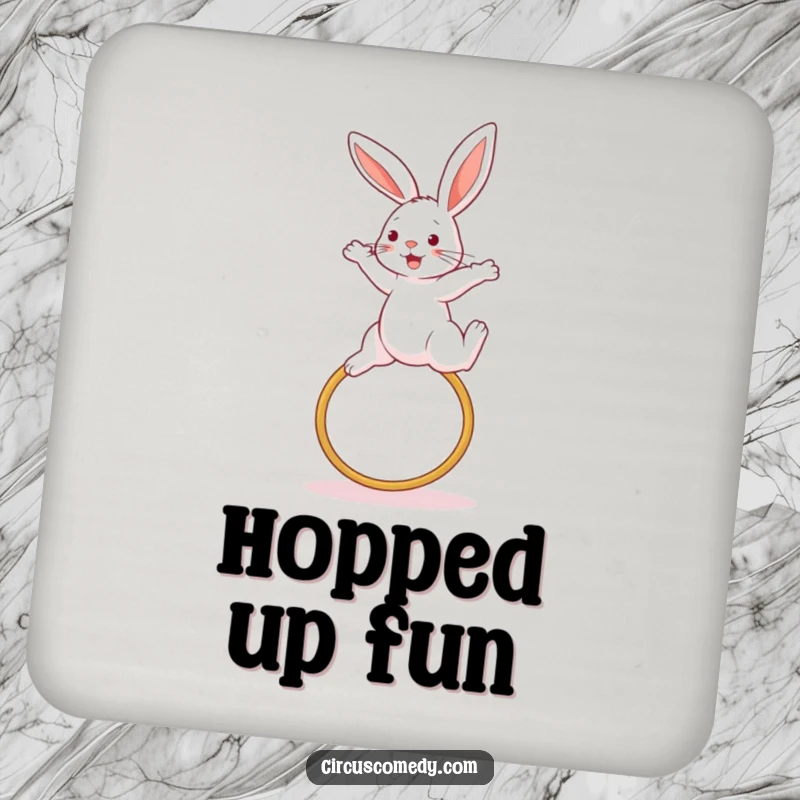 Funny rabbit coaster, illustrated in a dynamic high jump over a hoop, offering surface protection with athletic fun, a witty accessory.