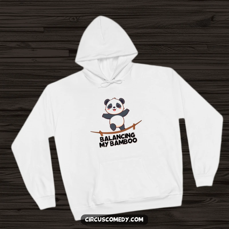 Funny panda hoodie showing a smiling panda walking a tightrope with cheerful determination, perfect for lounging.