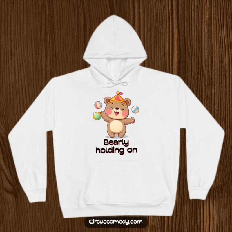Funny bear hoodie featuring a cute bear juggling colorful circus balls with a happy grin, perfect for chilly days.