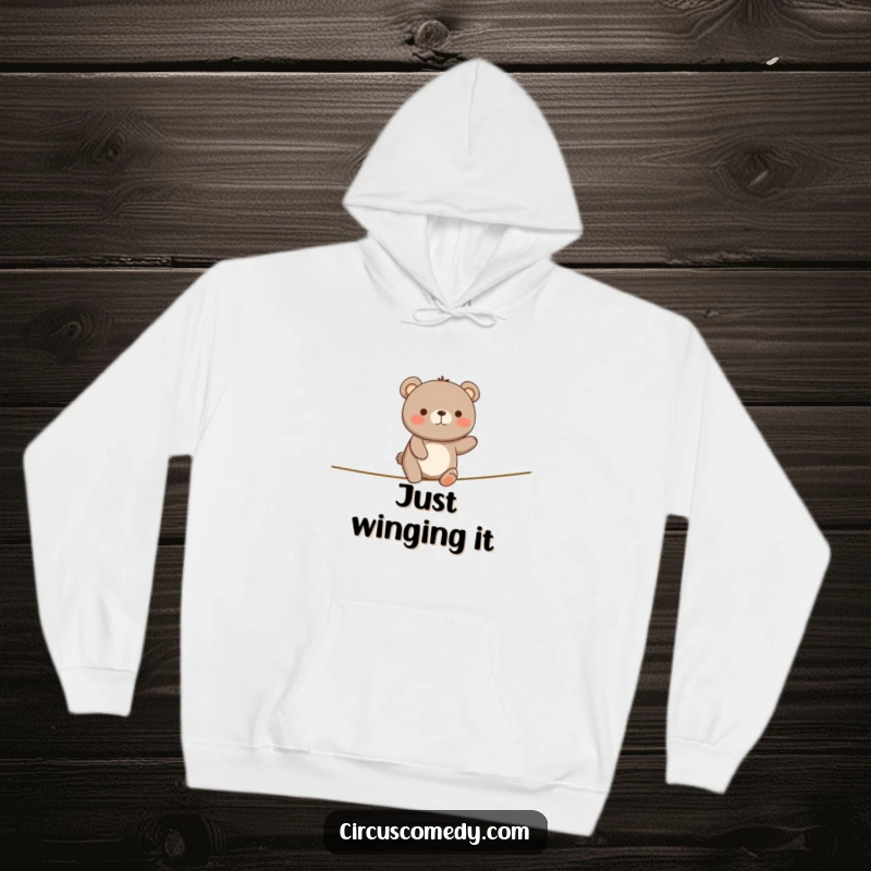 Funny Happy Bear Tightrope Hoodie: A bear wobbles on a tightrope looking happy, a cozy and funny apparel option.