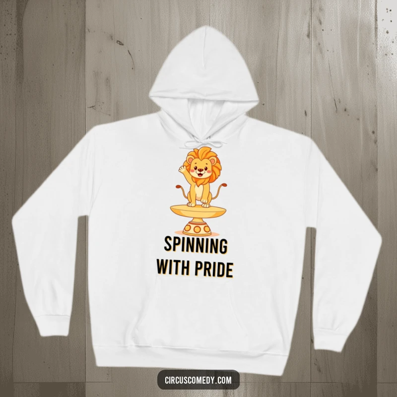 Funny lion hoodie, depicted balancing with grand poise on a spinning plate, radiating majestic humor, a warm and stately garment.