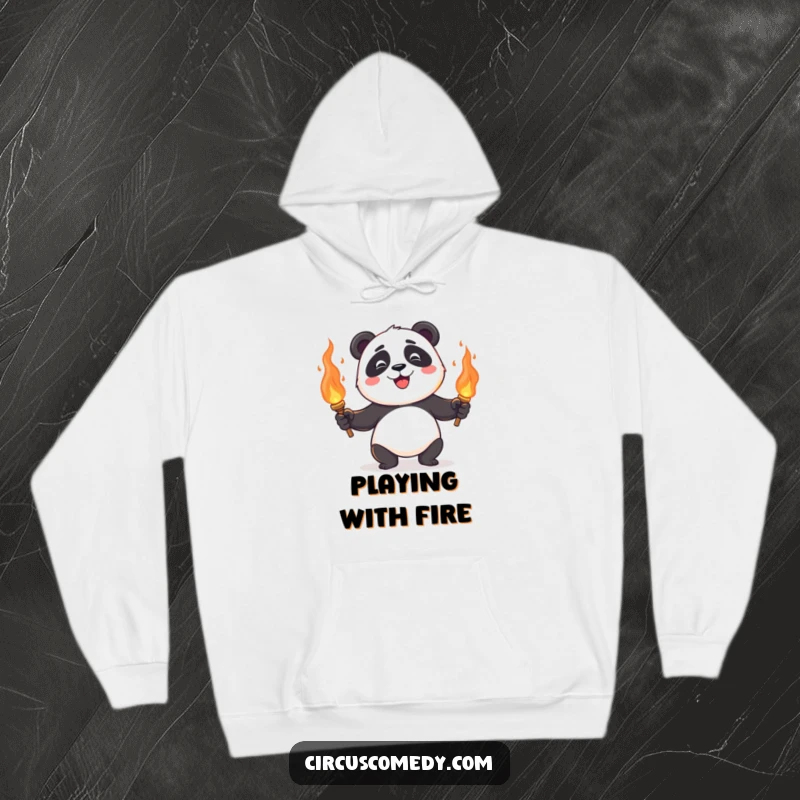 A happy panda juggling flaming torches, looking cool and collected despite the heat, on a comfortable hoodie.