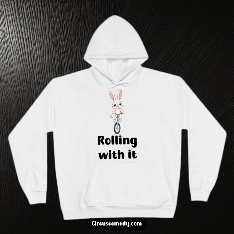Funny rabbit hoodie, a determined rabbit balancing on a unicycle, cozy and humorous design for chilly days.