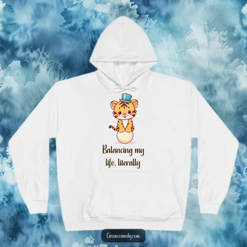 Funny hoodie graphic of a cute tiger in a tiny top hat, balancing on a circus ball, radiating pure joy and whimsy.