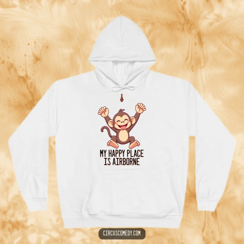 Funny hoodie design of a grinning monkey swinging with abandon from a trapeze, embodying freedom and pure joy.