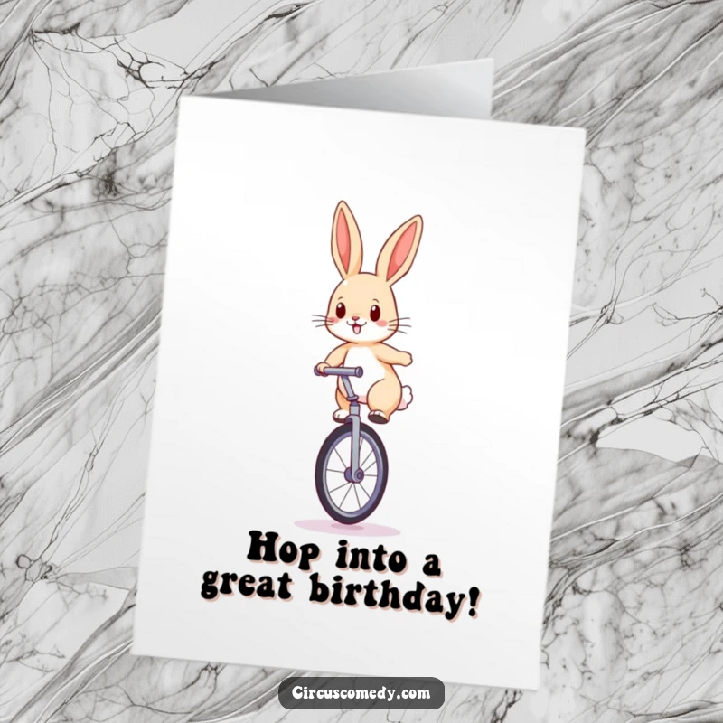 Funny Free Printable Birthday Card: Determined rabbit balancing on a unicycle, ears perked, with a focused expression.