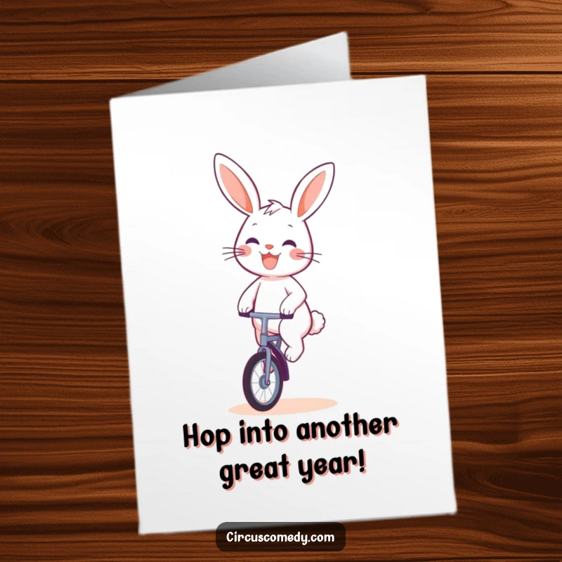 Funny Free Printable Birthday Card: Cute rabbit with a cheerful grin riding a unicycle.