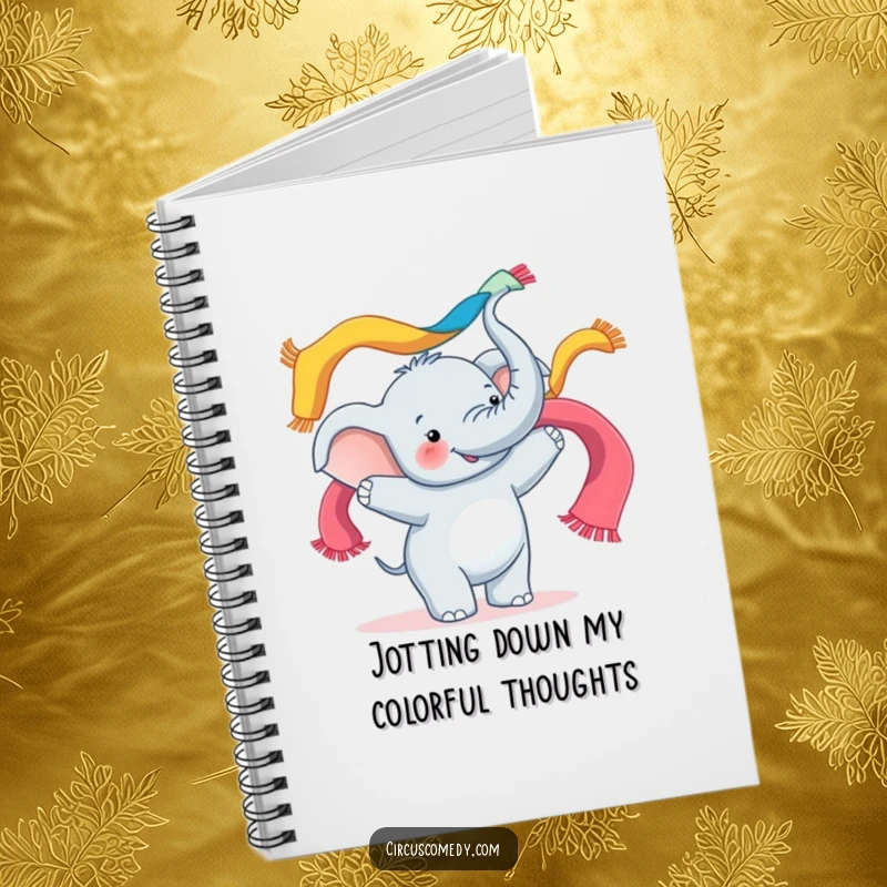 Funny notebook cover depicting a happy elephant juggling colorful scarves with its trunk, ideal for jotting down fun ideas.