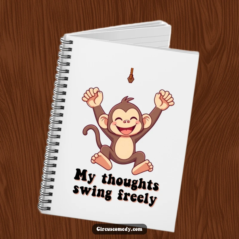 Funny notebook cover showing a grinning monkey swinging from a trapeze, perfect for capturing fun ideas and plans.