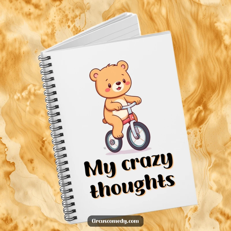 Funny notebook cover with a playful bear balancing on a unicycle, perfect for journaling and creative brainstorming.