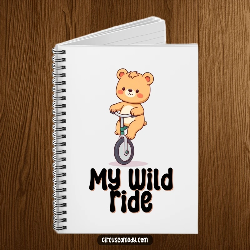 Funny notebook with a playful bear riding a unicycle, perfect for capturing inspired thoughts and adventure plans.
