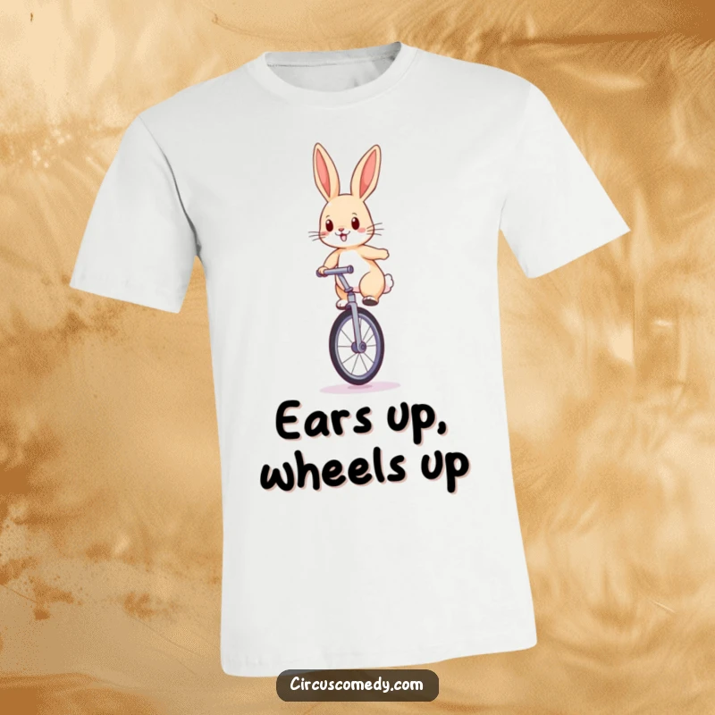 Funny rabbit t-shirt depicting a determined rabbit balancing on a large unicycle with perked ears, a true daredevil.
