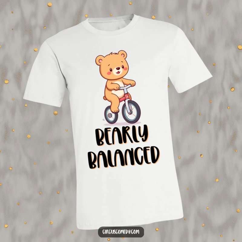 Funny t-shirt with a joyful bear balancing on a unicycle, looking delighted and slightly mischievous.