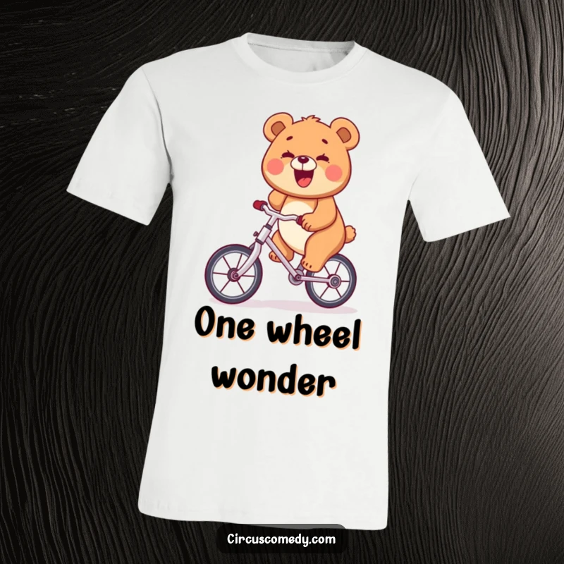 Funny happy bear riding a unicycle, big smile, on a t-shirt, symbolizing joy and balance.