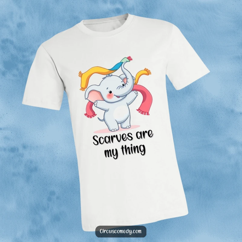 Funny t-shirt graphic of a happy elephant skillfully juggling multiple colorful scarves with its trunk, looking utterly pleased.