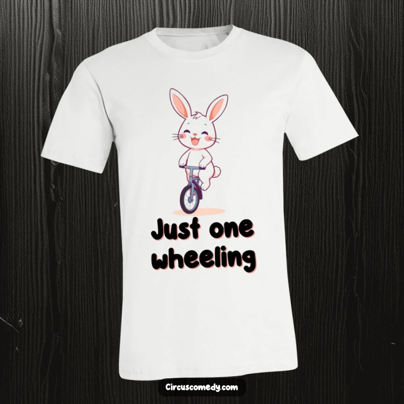 Funny Rabbit Unicyclist T-Shirt: A cute and cheerful rabbit character grins widely while expertly riding a unicycle.