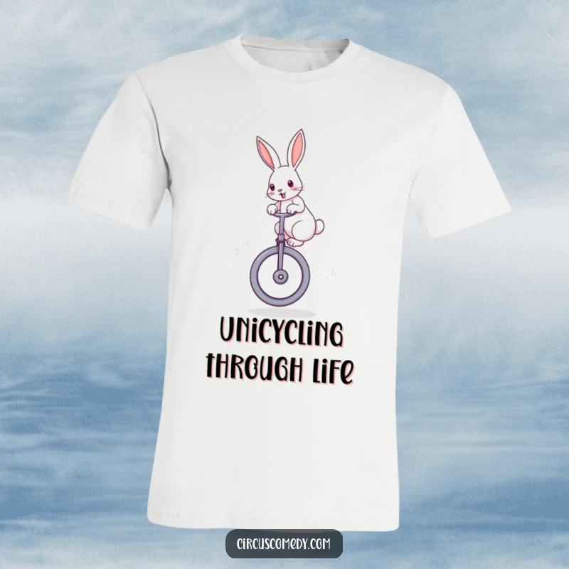 Funny rabbit t-shirt showcasing a determined rabbit with perked ears, expertly balancing atop a large unicycle with joyful concentration.