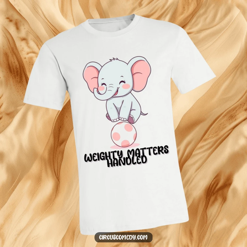 Funny Elephant Balancer T-Shirt: A joyful elephant character with a big smile performs a balancing act on a tiny circus ball.