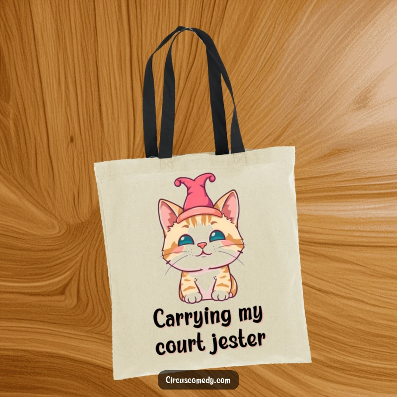 Funny cat tote bag, a content cat wearing a small jester hat, adding whimsical humor.